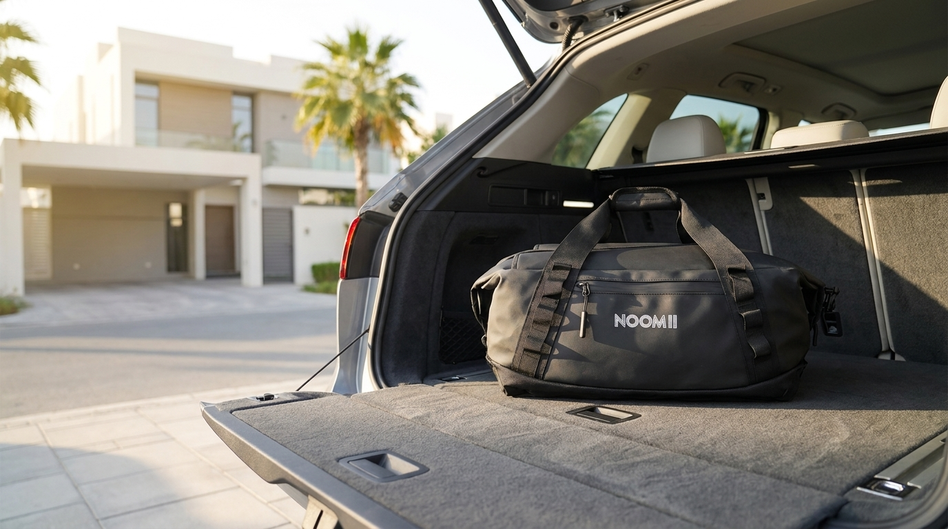 NooMii 2-in-1 gym bag in the trunk of an SUV in Dubai at sunrise